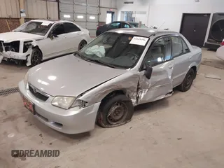 2000 Mazda Protege DX with VIN JM1BJ2226Y0206340, listed as a IAAI auction lot 41645396 with 238,500 mi miles and . Bid and sale history available at DreamBid. Image 2.