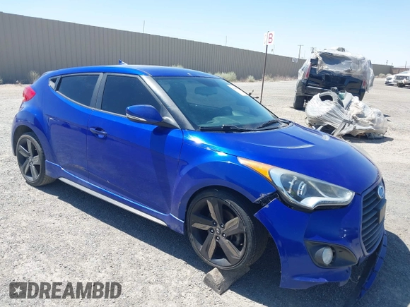 2015 Hyundai Veloster Turbo z VIN KMHTC6AE2FU218570, wystawiony jako IAAI lot #42609097 z przebiegiem 104 965 mil mil oraz . Historia ofert i sprzedaży dostępna na DreamBid. Obrazek 1.