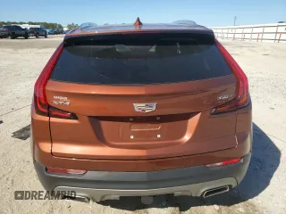 2021 Cadillac XT4 FWD Premium Luxury z VIN 1GYFZCR46MF076066, wystawiony jako Copart lot #47493235 z przebiegiem 21 550 mil mil oraz Nie do naprawy. Historia ofert i sprzedaży dostępna na DreamBid. Obrazek 6.