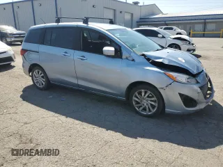 2012 Mazda 5 Sport with VIN JM1CW2BL2C0143227, listed as a Copart auction lot 71596794 with 231,473 mi miles and Salvage Title. Bid and sale history available at DreamBid. Image 4.