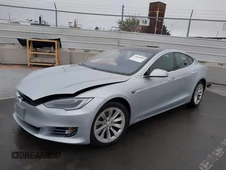 2016 Tesla Model S 70 with VIN 5YJSA1E17GF156514, listed as a IAAI auction lot 41869006 with 17,704 mi miles and . Bid and sale history available at DreamBid. Image 2.