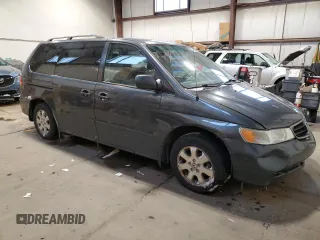 2003 Honda Odyssey EX with VIN 2HKRL18603H008412, listed as a Copart auction lot 87502365 with 352,773 mi miles and Salvage Title. Bid and sale history available at DreamBid. Image 4.
