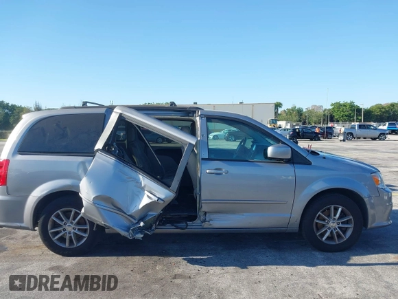 2015 Dodge Grand Caravan SXT with VIN 2C4RDGCG3FR592098, listed as a IAAI auction lot 42038665 with 104,092 mi miles and . Bid and sale history available at DreamBid. Image 6.
