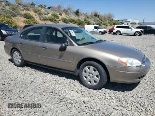 2003 Ford Taurus LX Standard z VIN 1FAFP52U63G277370, wystawiony jako Copart lot #56184345 z przebiegiem 115 778 mil mil oraz Szkoda całkowita • Salvage title. Historia ofert i sprzedaży dostępna na DreamBid. Obrazek 4.