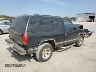 1999 Chevrolet Tahoe z VIN 3GNEC18R3XG165012, wystawiony jako Copart lot #75803204 z przebiegiem 227 608 mil mil oraz Szkoda całkowita • Salvage title. Historia ofert i sprzedaży dostępna na DreamBid. Obrazek 3.