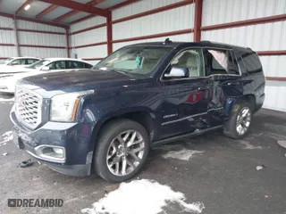 2018 GMC Yukon Denali with VIN 1GKS2CKJ5JR335718, listed as a IAAI auction lot 40991126 with 87,479 mi miles. Bid and sale history available at carsss.com. Image 2.