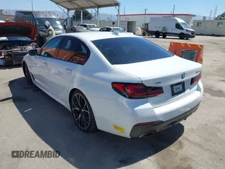 2022 BMW 5 Series 530e xDrive with VIN WBA33AG01NCJ52906, listed as a IAAI auction lot 42686511 with 45,710 mi miles and . Bid and sale history available at DreamBid. Image 3.