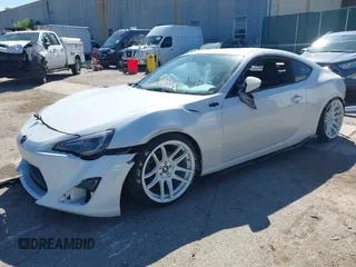 2013 Scion FR-S with VIN JF1ZNAA12D2720583, listed as a IAAI auction lot 40253195 with 113,006 mi miles. Bid and sale history available at carsss.com. Image 2.