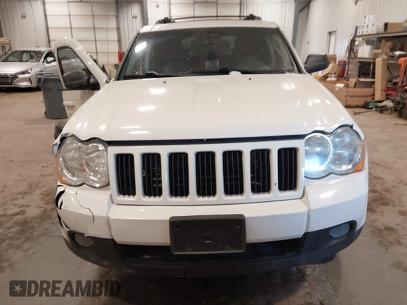 2010 Jeep Grand Cherokee Laredo with VIN 1J4PR4GK7AC126059, listed as a IAAI auction lot 41599058 with 154,192 mi miles. Bid and sale history available at carsss.com. Image 13.