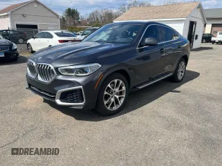 2021 BMW X6 xDrive40i with VIN 5UXCY6C02M9D88338, listed as a Copart auction lot 50947775 with 116,477 mi miles and Clean Title. Bid and sale history available at carsss.com. Image 1.