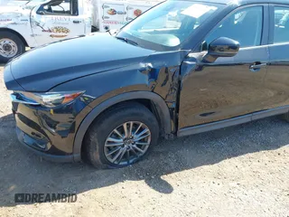 2020 Mazda CX-5 Sport with VIN JM3KFABM2L0761184, listed as a IAAI auction lot 41847768 with 47,582 mi miles. Bid and sale history available at carsss.com. Image 6.