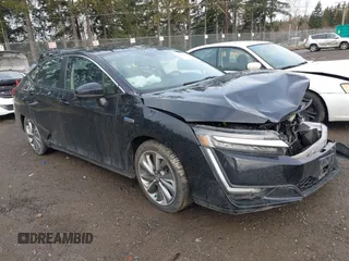 2018 Honda Clarity z VIN JHMZC5F11JC012135, wystawiony jako IAAI lot #41605559 z przebiegiem 93 836 mil mil oraz . Historia ofert i sprzedaży dostępna na DreamBid. Obrazek 1.