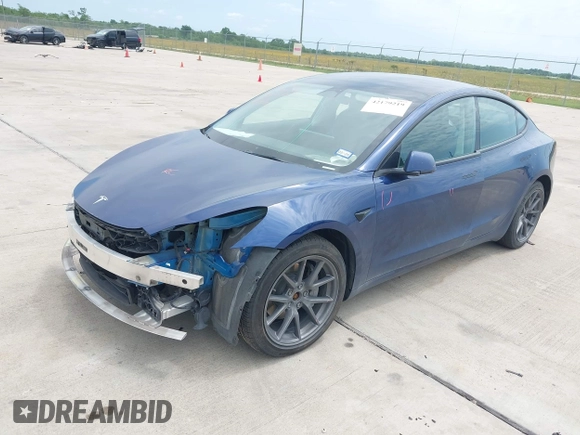 2022 Tesla Model 3 Long Range z VIN 5YJ3E1EB2NF246443, wystawiony jako IAAI lot #42179219 z przebiegiem Nie podano mil oraz . Historia ofert i sprzedaży dostępna na DreamBid. Obrazek 2.