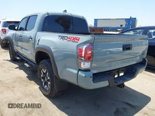 2022 Toyota Tacoma SR with VIN 3TYCZ5AN0NT104300, listed as a IAAI auction lot 42652503 with 18,071 mi miles and . Bid and sale history available at DreamBid. Image 3.