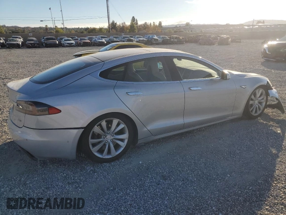 2016 Tesla Model S 90D with VIN 5YJSA1E26GF147974, listed as a Copart auction lot 82815404 with 126,609 mi miles and Salvage Title. Bid and sale history available at DreamBid. Image 3.