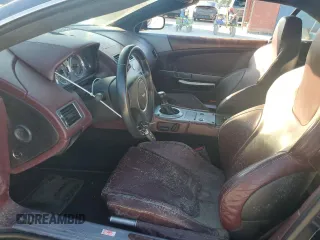2006 Aston Martin DB9 z VIN SCFAB02A96GB04608, wystawiony jako Copart lot #76550654 z przebiegiem Nie podano mil oraz Nie do naprawy. Historia ofert i sprzedaży dostępna na DreamBid. Obrazek 7.