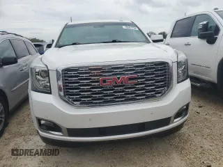 2019 GMC Yukon Denali with VIN 1GKS1CKJ0KR395653, listed as a Copart auction lot 79501764 with 0 mi miles and Salvage Title. Bid and sale history available at carsss.com. Image 5.