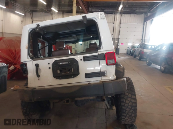 2012 Jeep Wrangler Arctic z VIN 1C4AJWBG9CL233232, wystawiony jako IAAI lot #42282805 z przebiegiem 109 927 mil mil oraz . Historia ofert i sprzedaży dostępna na DreamBid. Obrazek 16.