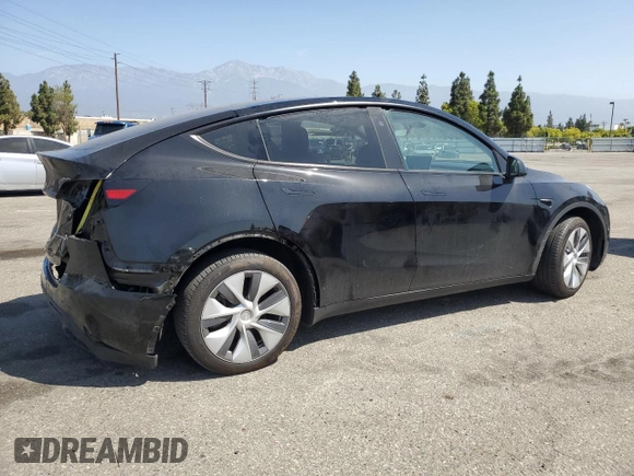 2024 Tesla Model Y Long Range with VIN 7SAYGDEE6RA219456, listed as a Copart auction lot 61855165 with 29,869 mi miles and Salvage title. Bid and sale history available at DreamBid. Image 3.