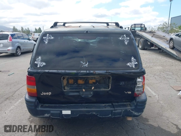 1996 Jeep Grand Cherokee Limited z VIN 1J4GZ78Y3TC191000, wystawiony jako IAAI lot #42259621 z przebiegiem 212 690 mil mil oraz . Historia ofert i sprzedaży dostępna na DreamBid. Obrazek 16.