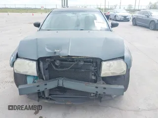 2006 Chrysler 300 with VIN 2C3KA43R56H217771, listed as a IAAI auction lot 41859397 with 154,227 mi miles. Bid and sale history available at carsss.com. Image 6.