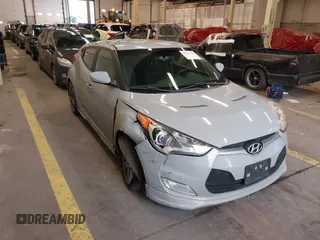 2013 Hyundai Veloster w/Black Int with VIN KMHTC6AD2DU128534, listed as a IAAI auction lot 41791398 with 158,414 mi miles and . Bid and sale history available at DreamBid. Image 1.