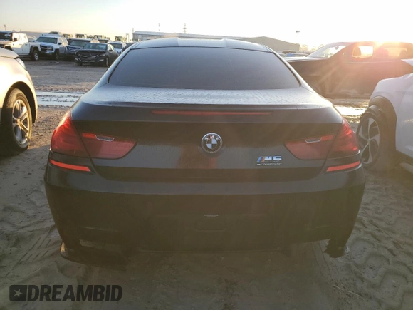2017 BMW M6 z VIN WBS6J9C3XHD934858, wystawiony jako Copart lot #73714104 z przebiegiem Nie podano mil oraz Szkoda całkowita • Salvage title. Historia ofert i sprzedaży dostępna na DreamBid. Obrazek 6.