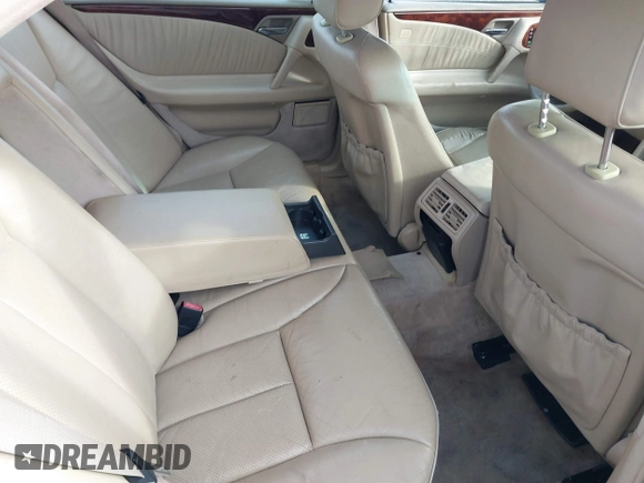 1999 Mercedes-Benz E-Class with VIN WDBJF65H1XA817789, listed as a IAAI auction lot 41818511 with 999,999 mi miles. Bid and sale history available at carsss.com. Image 8.