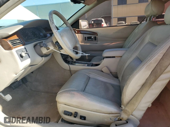 2000 Cadillac Eldorado z VIN 1G6EL12Y0YB702117, wystawiony jako Copart lot #80297854 z przebiegiem 124 851 mil mil oraz Szkoda całkowita • Salvage title. Historia ofert i sprzedaży dostępna na DreamBid. Obrazek 7.