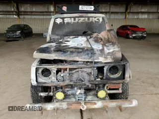 1986 Suzuki Samurai z VIN JS3JC51V1G4101572, wystawiony jako Copart lot #82712734 z przebiegiem Nie podano mil oraz Szkody całkowita. Historia ofert i sprzedaży dostępna na DreamBid. Obrazek 5.