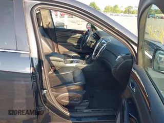 2014 Cadillac SRX Performance Collection with VIN 3GYFNFE35ES663320, listed as a IAAI auction lot 42480235 with 112,406 mi miles and . Bid and sale history available at DreamBid. Image 5.