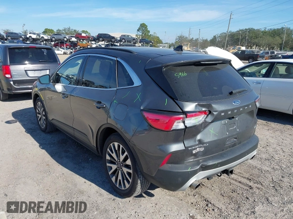 2020 Ford Escape Titanium with VIN 1FMCU9J9XLUA66440, listed as a IAAI auction lot 41464049 with 57,626 mi miles and . Bid and sale history available at DreamBid. Image 3.