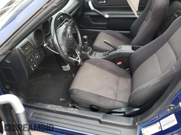 2003 Toyota MR2 z VIN JTDFR320530065705, wystawiony jako Copart lot #86298474 z przebiegiem 103 268 mil mil oraz Szkoda całkowita • Salvage title. Historia ofert i sprzedaży dostępna na DreamBid. Obrazek 7.