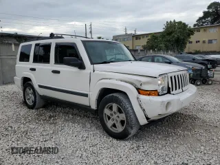 2006 Jeep Commander with VIN 1J8HH48N06C352871, listed as a Copart auction lot 87740115 with 163,703 mi miles and Salvage Title. Bid and sale history available at carsss.com. Image 4.