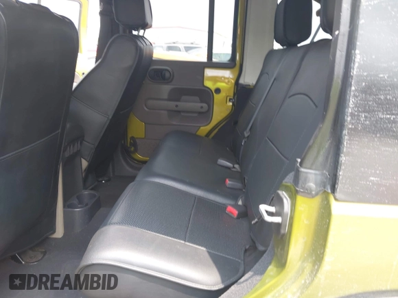 2008 Jeep Wrangler Unlimited Sahara with VIN 1J8GA59108L574959, listed as a IAAI auction lot 42171011 with Not Provided miles and . Bid and sale history available at carsss.com. Image 8.