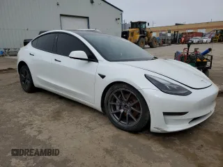 2022 Tesla Model 3 Long Range with VIN 5YJ3E1EB3NF353131, listed as a Copart auction lot 52582025 with 68,745 mi miles and Salvage Title. Bid and sale history available at carsss.com. Image 4.