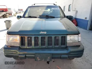 1998 Jeep Grand Cherokee Limited with VIN 1J4GZ78Y1WC124156, listed as a Copart auction lot 77587394 with 176,936 mi miles and Clean Title. Bid and sale history available at carsss.com. Image 5.