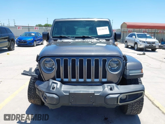 2018 Jeep Wrangler Unlimited Sahara with VIN 1C4HJXEN1JW236779, listed as a IAAI auction lot 42238158 with 72,879 mi miles and . Bid and sale history available at DreamBid. Image 13.