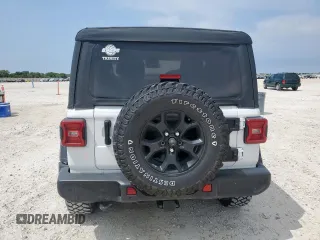 2022 Jeep Wrangler Sport S with VIN 1C4GJXAG5NW259605, listed as a Copart auction lot 57659775 with 14,864 mi miles and Salvage title. Bid and sale history available at DreamBid. Image 6.