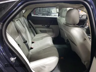 2014 Jaguar XJ Portfolio with VIN SAJWJ2GD5E8V69562, listed as a Copart auction lot 87737195 with 100,525 mi miles and Salvage title. Bid and sale history available at DreamBid. Image 10.