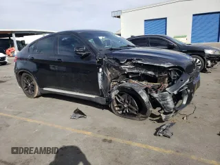 2011 BMW X6 50i with VIN 5UXFG8C52BLZ95196, listed as a Copart auction lot 79100194 with 0 mi miles and Salvage Title. Bid and sale history available at carsss.com. Image 4.