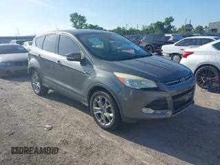 2013 Ford Escape SEL with VIN 1FMCU0HX4DUC34560, listed as a IAAI auction lot 42560349 with 156,637 mi miles and . Bid and sale history available at DreamBid. Image 1.