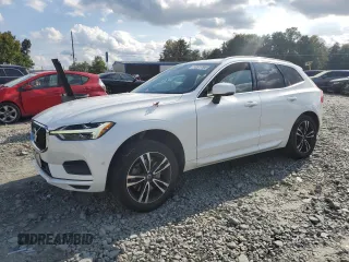 2019 Volvo XC60 Momentum with VIN YV4A22RK4K1371607, listed as a Copart auction lot 74207784 with 104,833 mi miles and Salvage title. Bid and sale history available at DreamBid. Image 1.