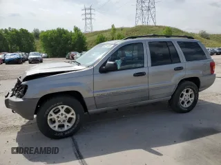 2000 Jeep Grand Cherokee Laredo with VIN 1J4GW48N1YC324356, listed as a Copart auction lot 62011305 with 242,322 mi miles and Salvage title. Bid and sale history available at DreamBid. Image 1.