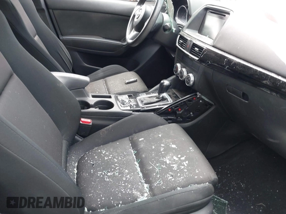 2016 Mazda CX-5 Sport with VIN JM3KE2BYXG0668401, listed as a IAAI auction lot 42370910 with Not provided miles and . Bid and sale history available at DreamBid. Image 5.