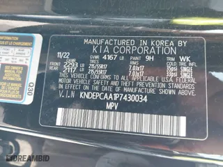 2023 Kia Seltos LX with VIN KNDEPCAA1P7430034, listed as a IAAI auction lot 41609879 with 52,548 mi miles. Bid and sale history available at carsss.com. Image 9.