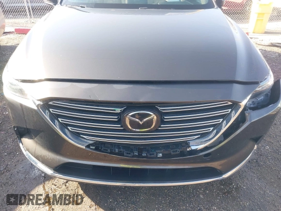 2016 Mazda CX-9 Grand Touring z VIN JM3TCBDY3G0104001, wystawiony jako IAAI lot #41961054 z przebiegiem 77 057 mil mil oraz . Historia ofert i sprzedaży dostępna na DreamBid. Obrazek 6.