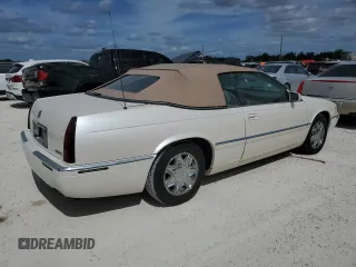 2002 Cadillac Eldorado z VIN 1G6EL12Y32B102263, wystawiony jako Copart lot #77108634 z przebiegiem 43 162 mil mil oraz Nie do naprawy • Non repairable. Historia ofert i sprzedaży dostępna na DreamBid. Obrazek 3.