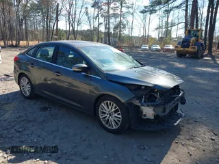 2015 Ford Focus Titanium with VIN 1FADP3J25FL333743, listed as a IAAI auction lot 41857057 with 120,917 mi miles and . Bid and sale history available at carsss.com. Image 1.