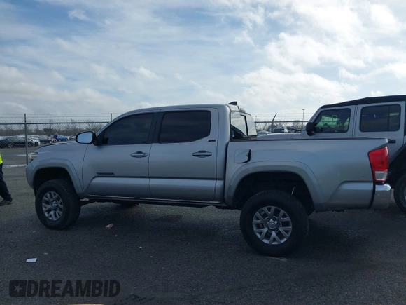 2018 Toyota Tacoma SR5 with VIN 5TFAZ5CN6JX057889, listed as a IAAI auction lot 41449604 with 114,888 mi miles and . Bid and sale history available at DreamBid. Image 14.